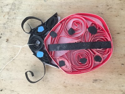 A paper-quilled lady bug