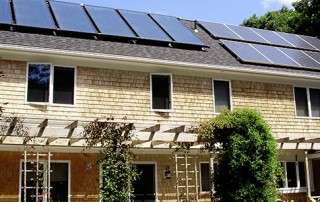 Home with both solar electric and solar hot water panels